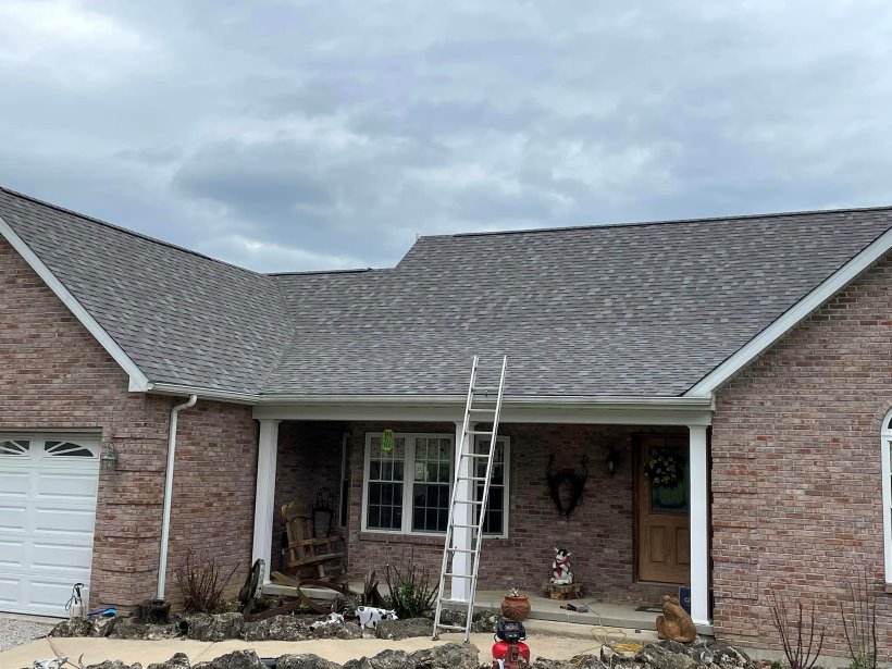 Residential home with newly installed roof by Craig's  Roofing